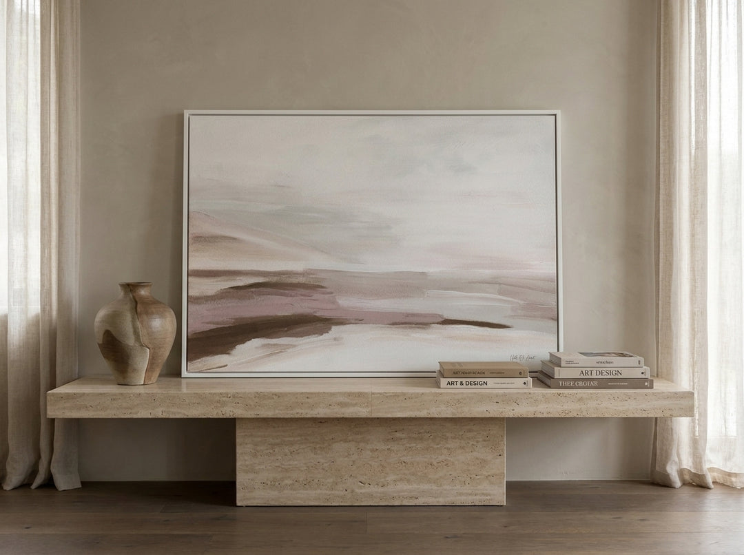 Modern wall art print standing on a console in a luxe living room