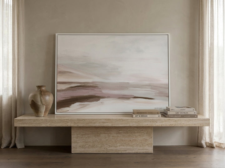 Modern wall art print standing on a console in a luxe living room