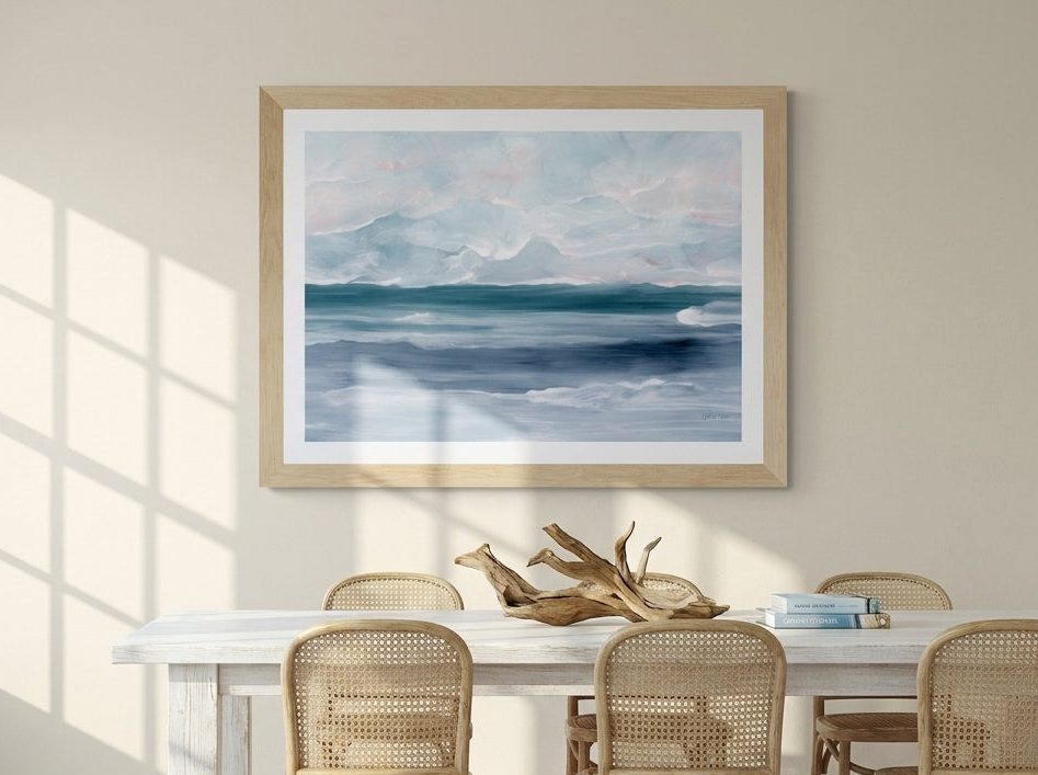 Modern wall art print styled on the wall in a coastal dining room