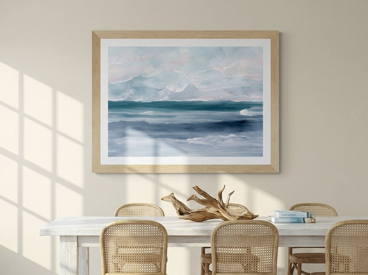Modern wall art print styled on the wall in a coastal dining room