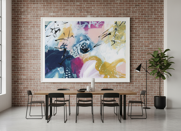 Oversized statement modern wall art print styled on the wall in an industrial loft dining room