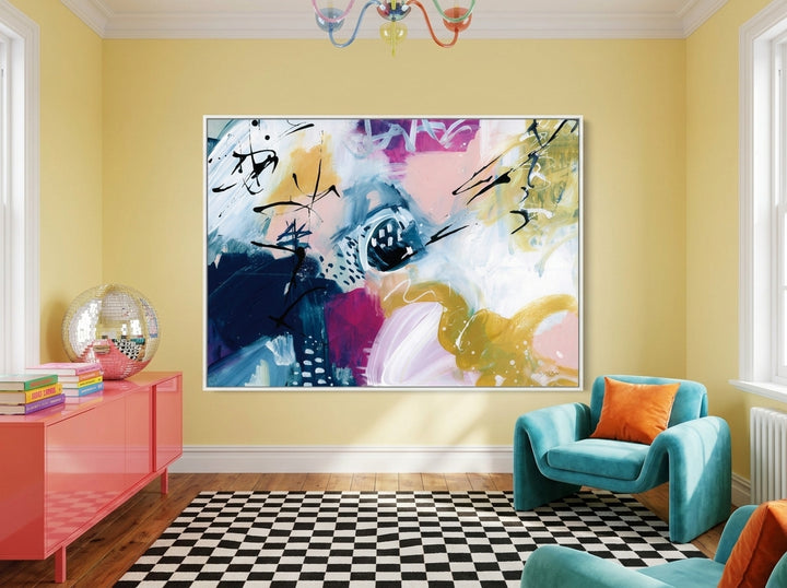 Oversized statement modern wall art print styled on the wall in a colourful eclectic living room