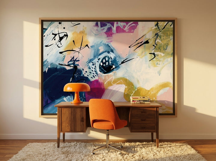 Canvas wall art with a natural timber surround styled on the wall in a retro 70s home office