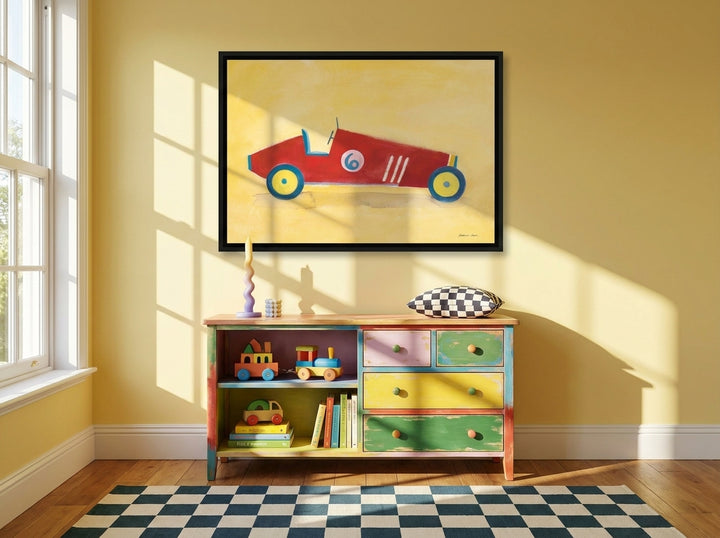 Canvas wall art with a black surround styled on the wall in a colourful eclectic nursery