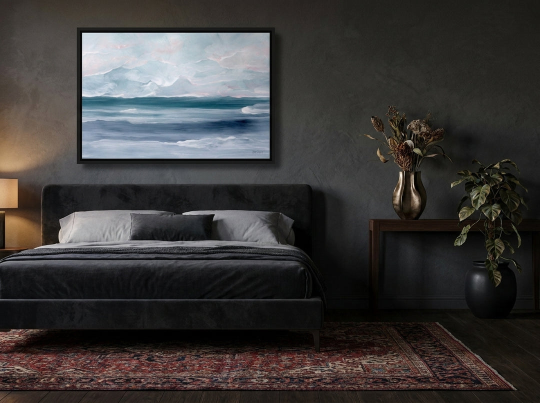 Canvas wall art with a black surround styled on the wall in a moody bedroom