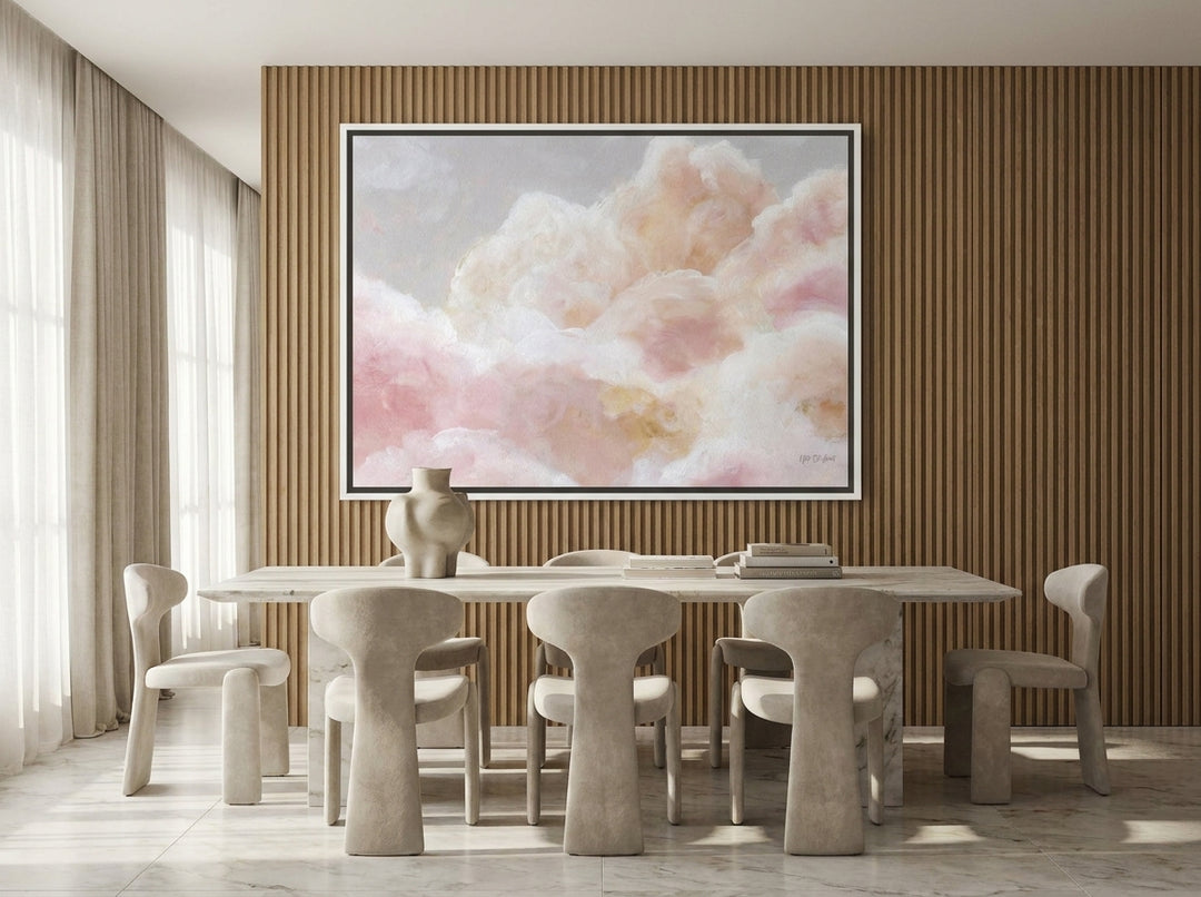 Oversized statement canvas wall art with a white surround styled on the wall in a luxe dining room