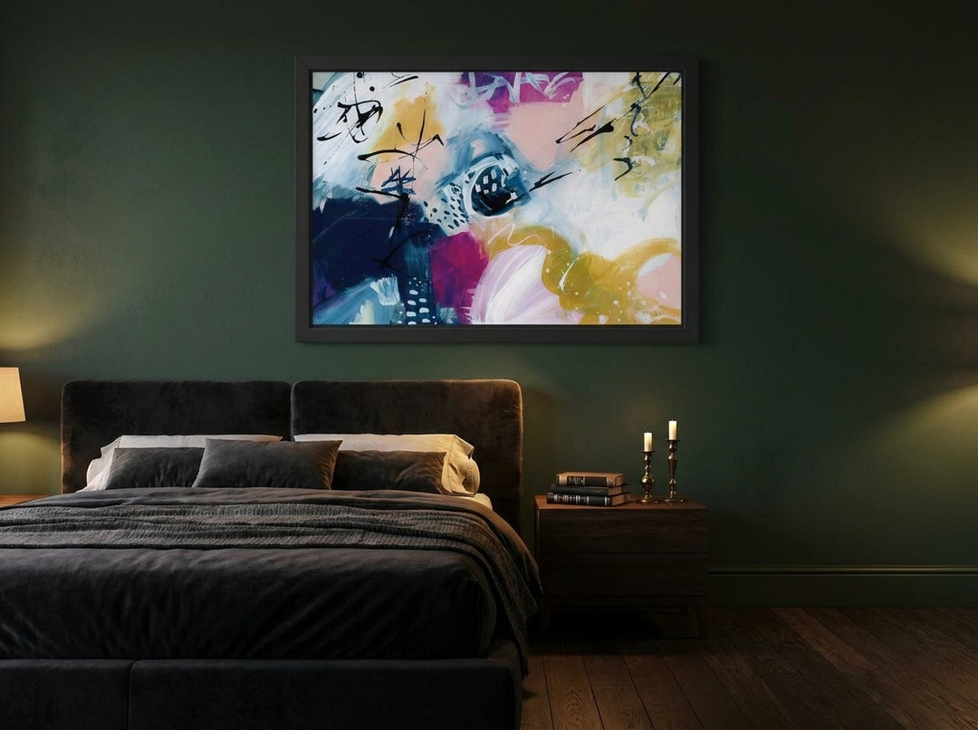 Modern wall art print styled on the wall in a moody bedroom