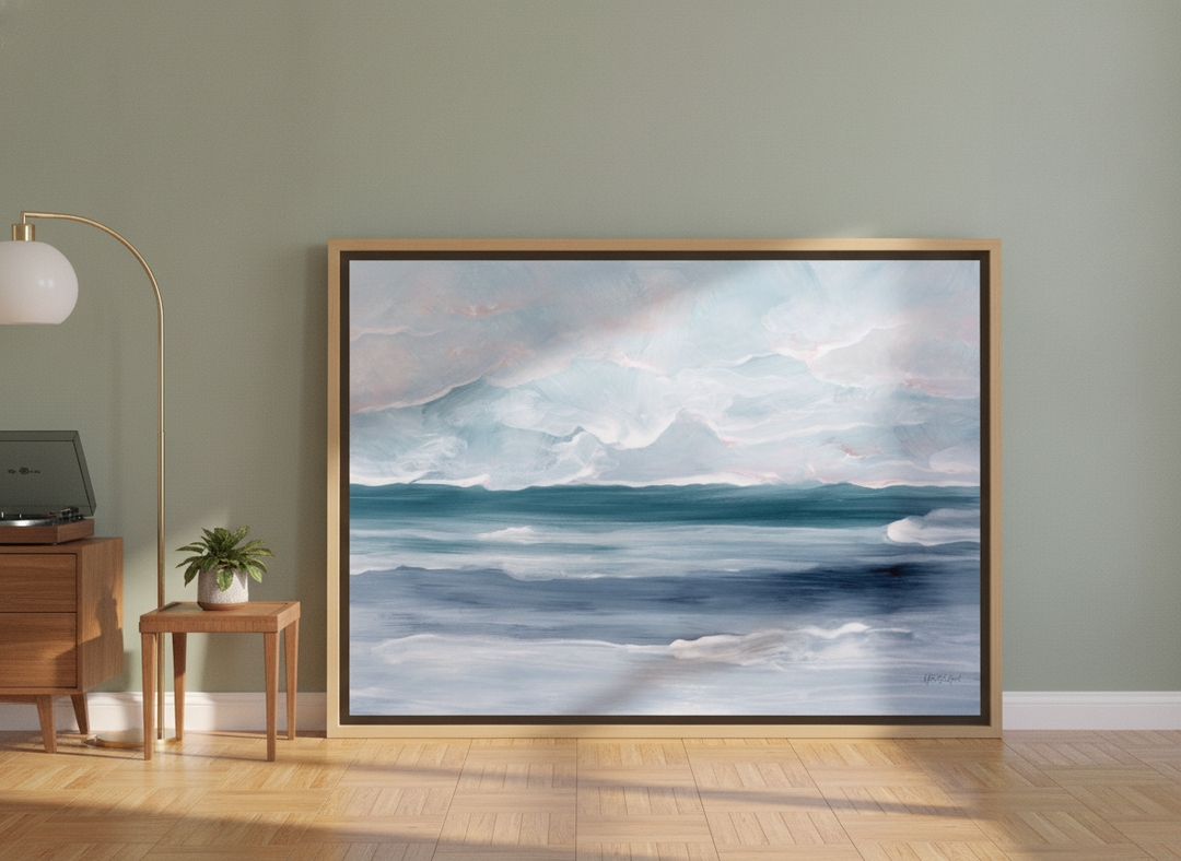 Oversized statement canvas wall art with a natural timber surround leaning against the wall in a mid-century living room