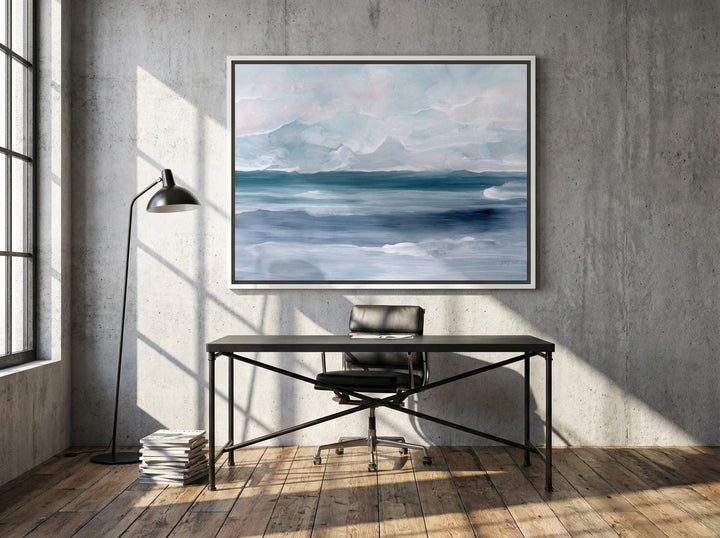 Canvas wall art with a white surround styled on the wall in an industrial loft home office