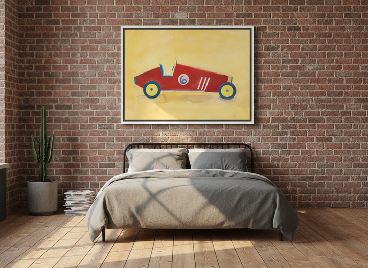 Canvas wall art with a white surround styled on the wall in an industrial loft bedroom
