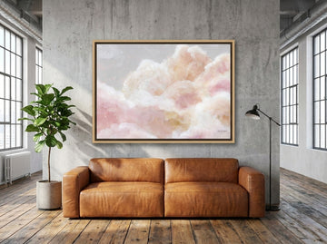 Oversized statement canvas wall art with a natural timber surround styled on the wall in an industrial loft living room