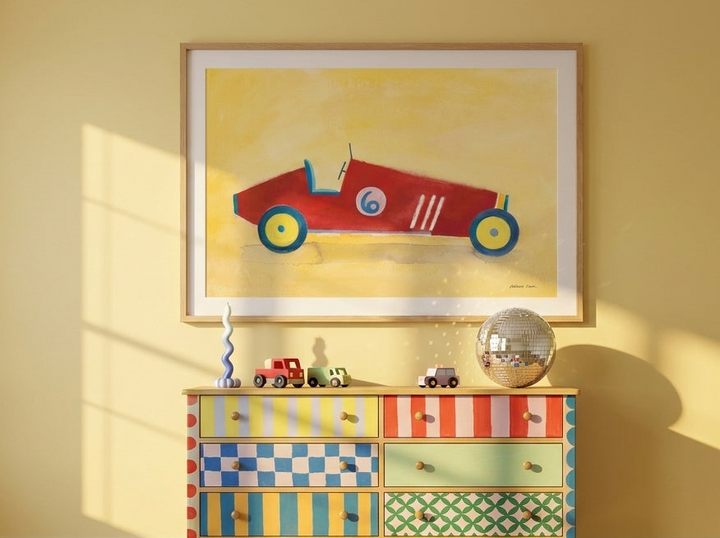 Modern wall art print styled on the wall in a colourful eclectic nursery