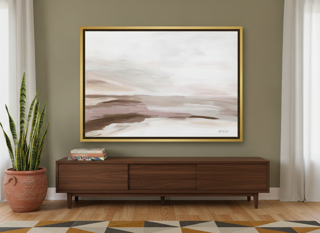 Canvas wall art with a gold leaf surround standing on a sideboard in a mid-century living room