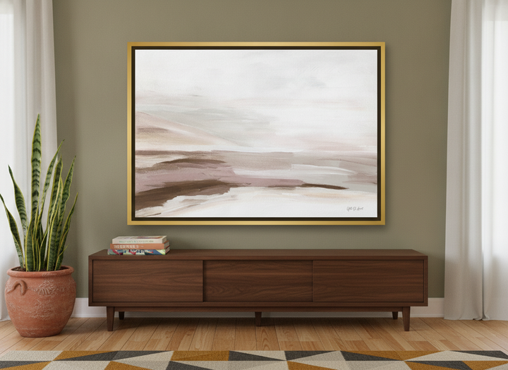 Canvas wall art with a gold leaf surround standing on a sideboard in a mid-century living room