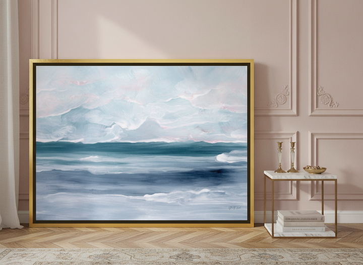 Canvas wall art with a gold leaf surround leaning against the wall in a Parisian bathroom