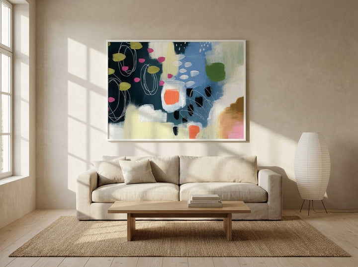 Oversized statement modern wall art print styled on the wall in a warm Japandi living room