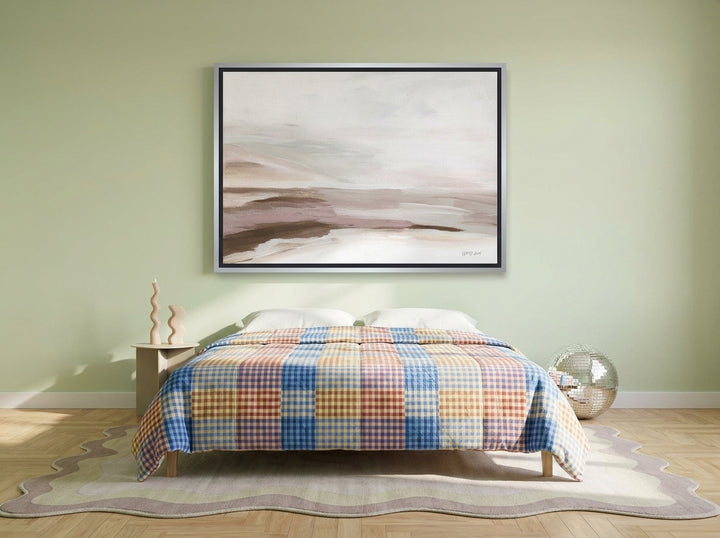 Canvas wall art with a silver leaf surround styled on the wall in a colourful eclectic bedroom