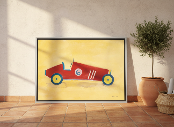 Canvas wall art with a silver leaf surround leaning against the wall in a Mediterranean home office