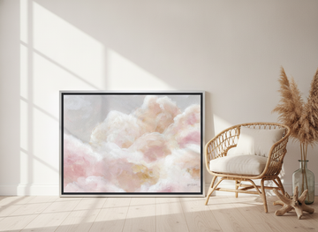 Canvas wall art with a silver leaf surround leaning against the wall in a coastal nursery