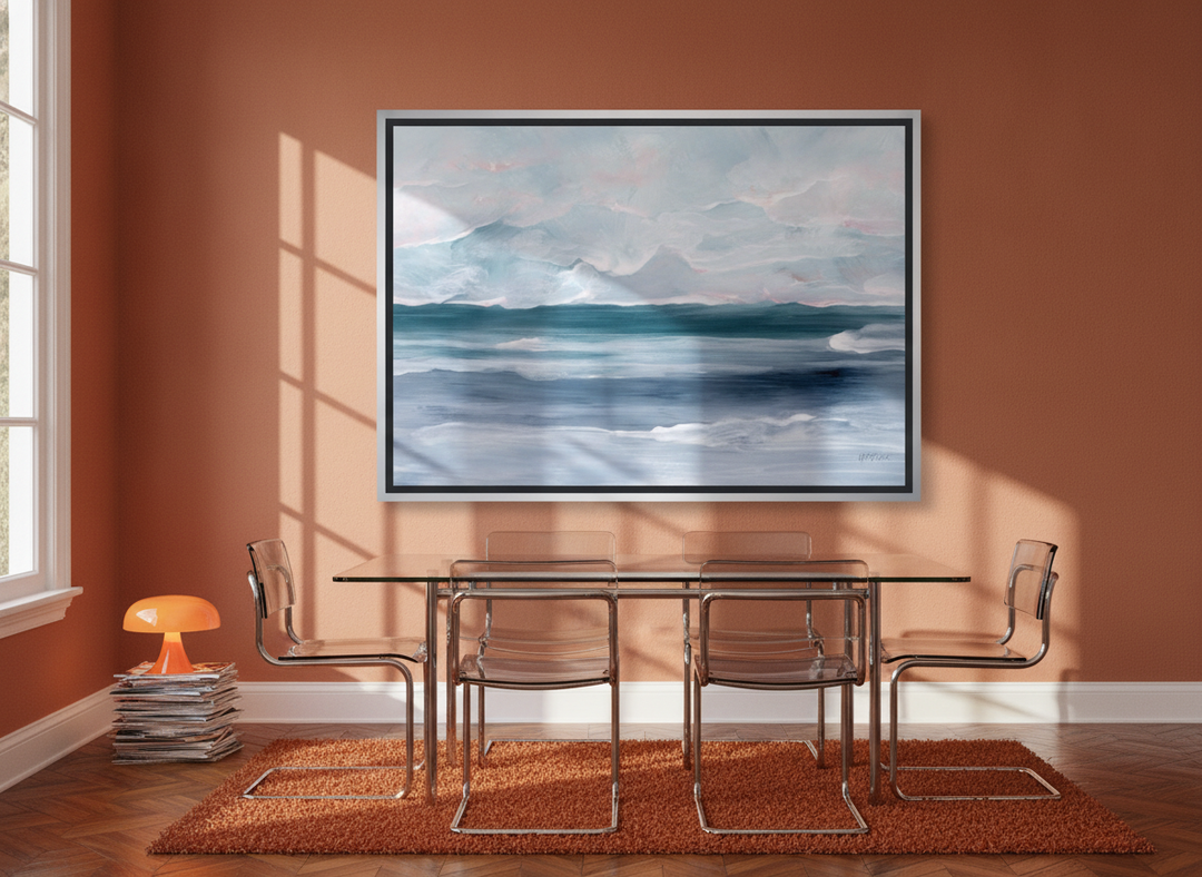 Oversized statement canvas wall art with a silver leaf surround styled on the wall in a retro 70s dining room