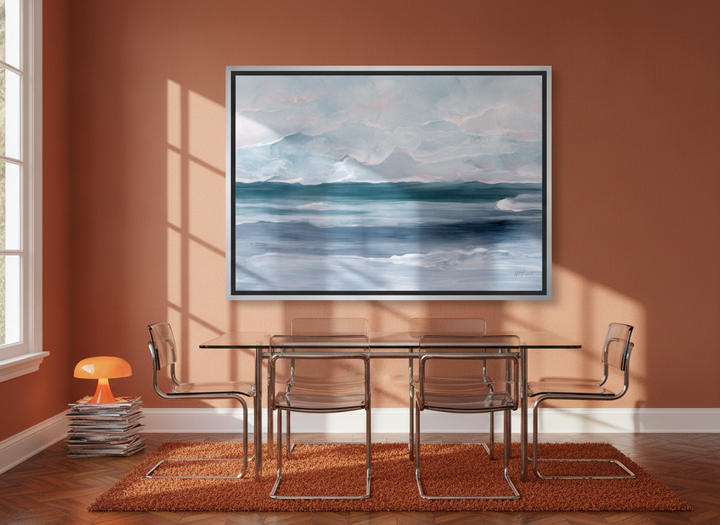 Oversized statement canvas wall art with a silver leaf surround styled on the wall in a retro 70s dining room