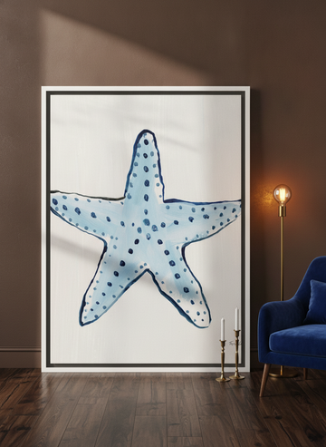 Oversized statement canvas wall art with a white surround leaning against the wall in a moody living room