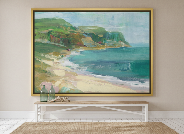 Oversized statement canvas wall art with a gold leaf surround styled on the wall in a coastal living room