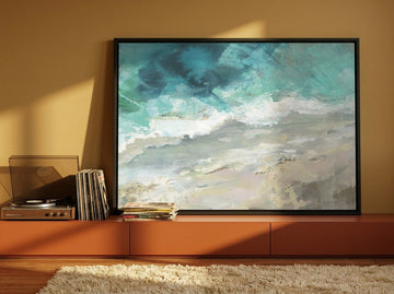 Canvas wall art with a black surround standing on a sideboard in a retro 70s bedroom