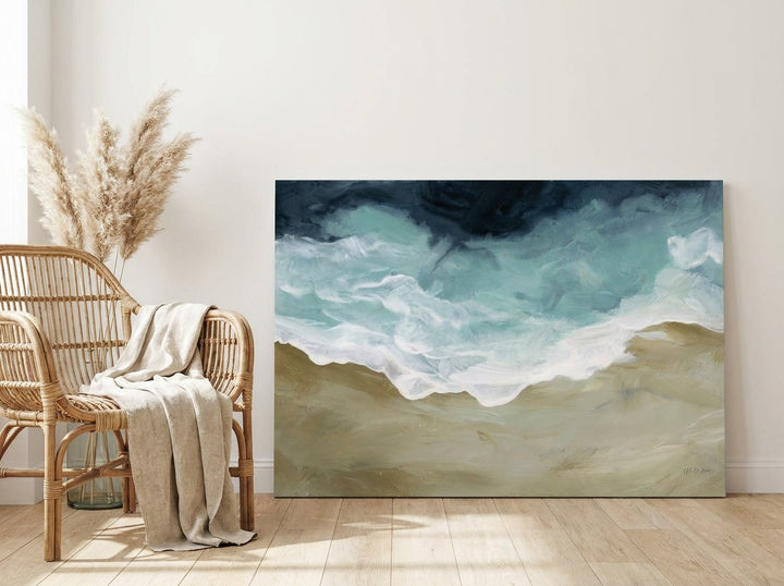 Stretched canvas wall art leaning against the wall in a coastal dining room
