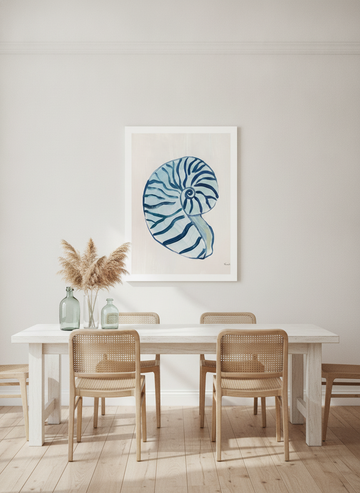 Oversized statement modern wall art print styled on the wall in a coastal dining room