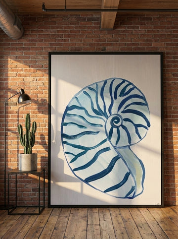 Oversized statement canvas wall art with a black surround leaning against the wall in an industrial loft living room