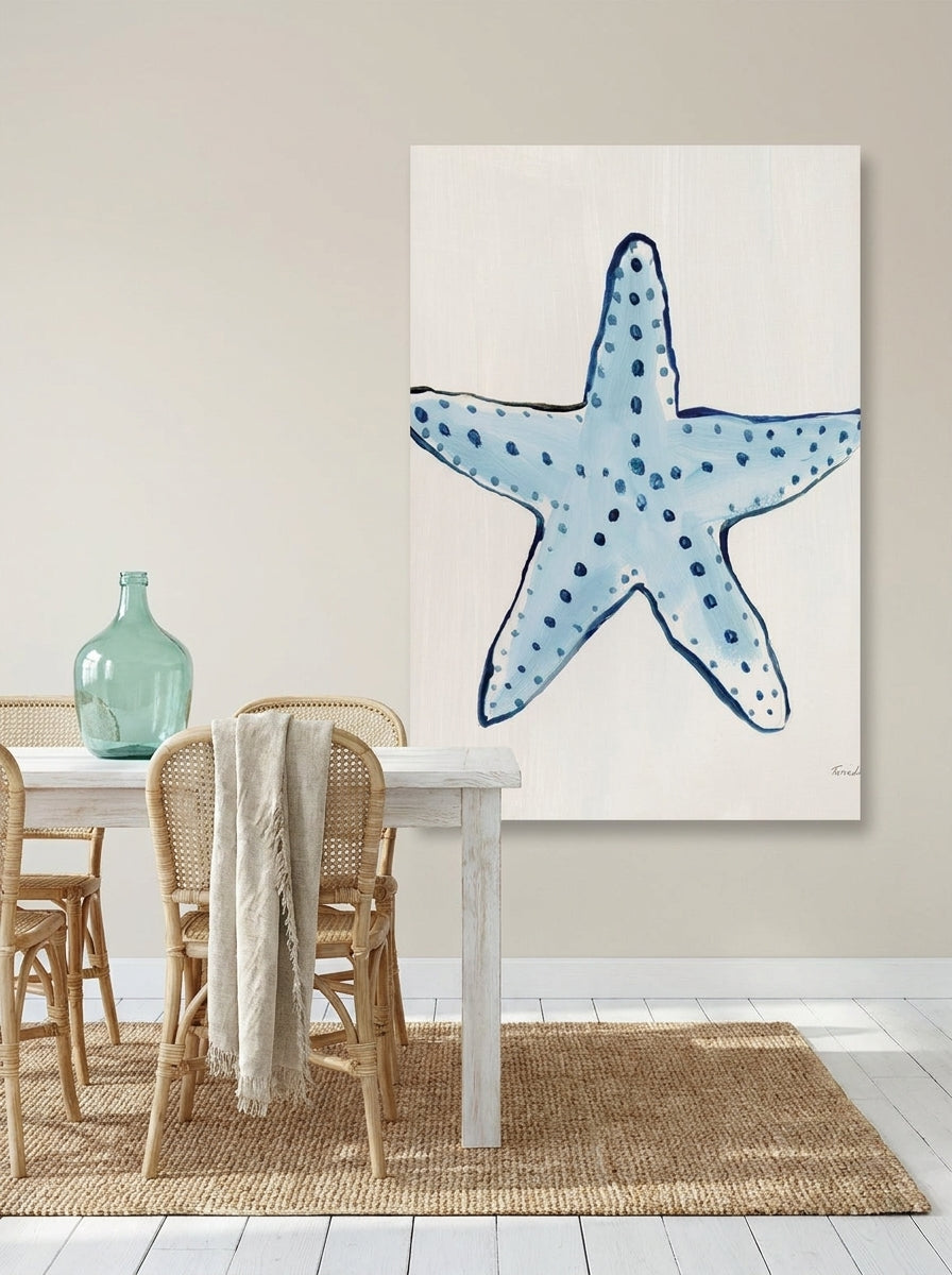 Stretched canvas wall art styled on the wall in a coastal dining room