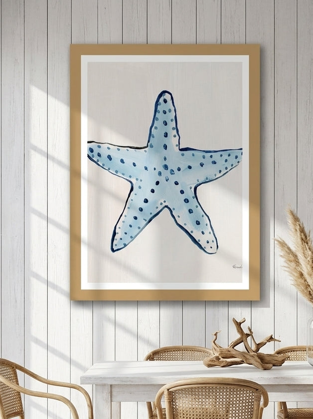 Modern wall art print styled on the wall in a coastal dining room