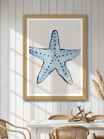 Modern wall art print styled on the wall in a coastal dining room