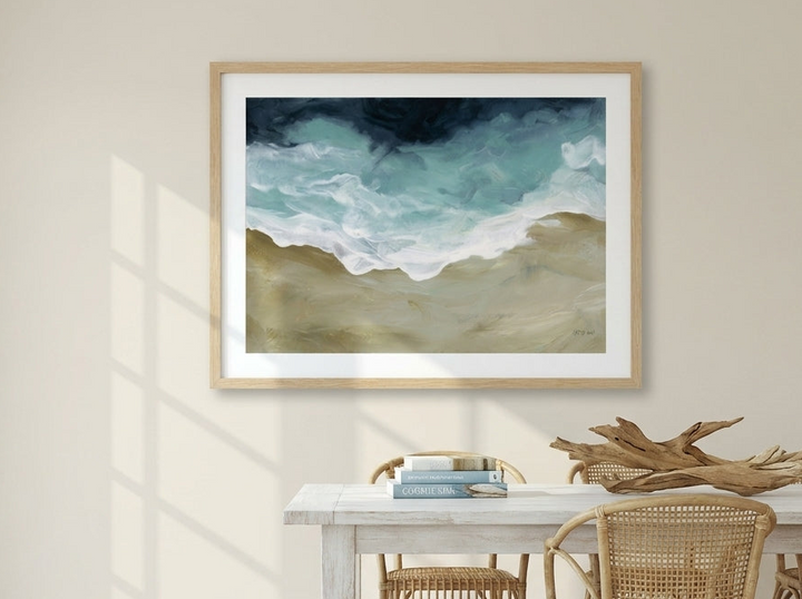 Modern wall art print styled on the wall in a coastal dining room