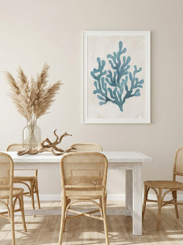 Modern wall art print styled on the wall in a coastal dining room