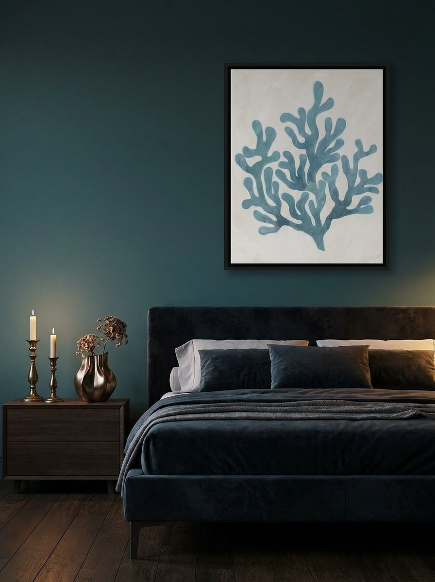 Canvas wall art with a black surround styled on the wall in a moody bedroom