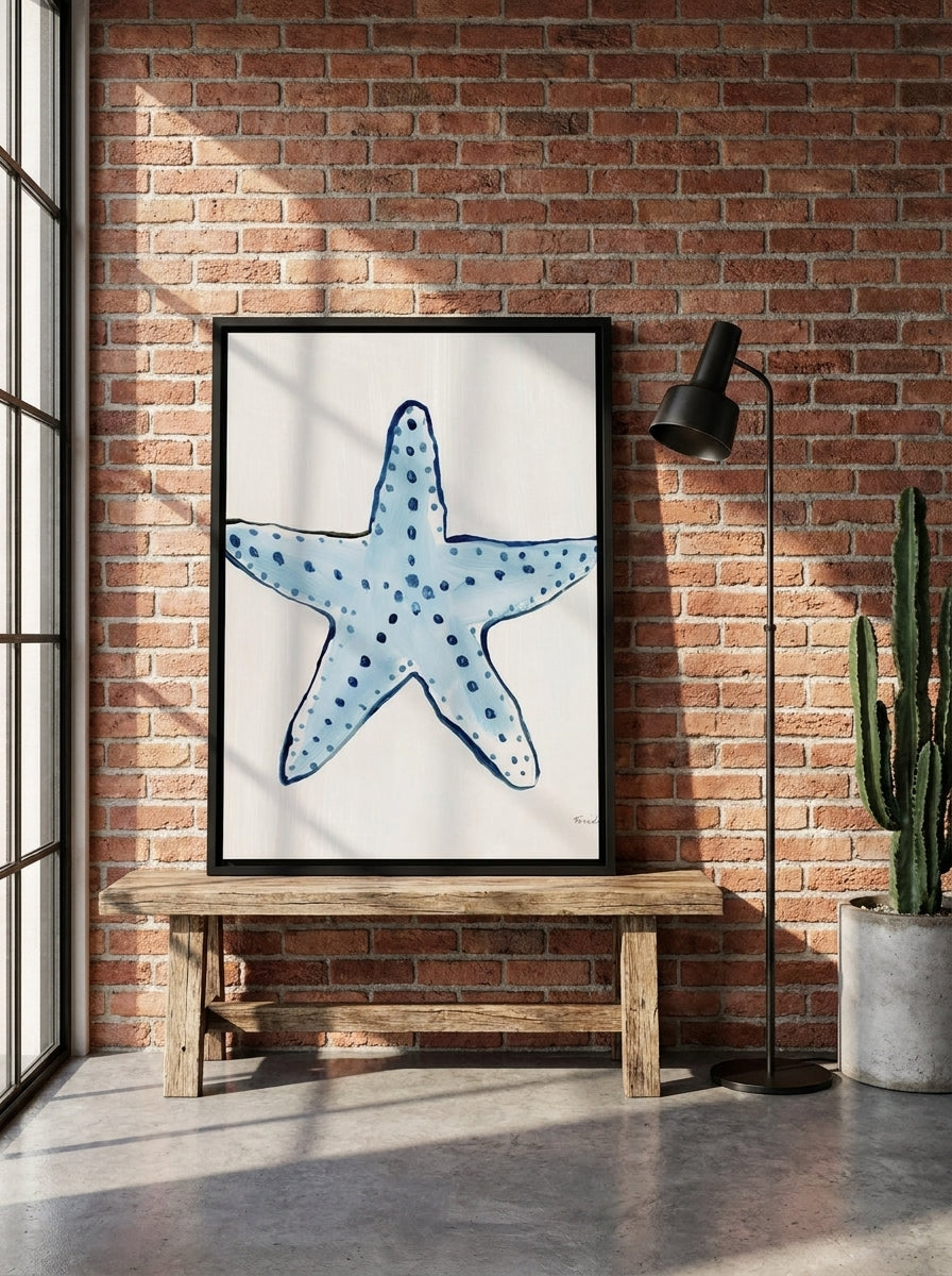 Canvas wall art with a black surround standing on a bench in an industrial loft bedroom