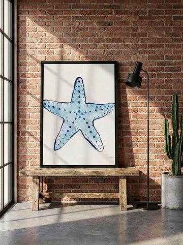 Canvas wall art with a black surround standing on a bench in an industrial loft bedroom