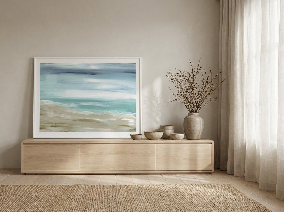 Modern wall art print standing on a sideboard in a warm Japandi bedroom
