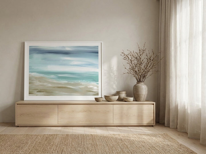 Modern wall art print standing on a sideboard in a warm Japandi bedroom