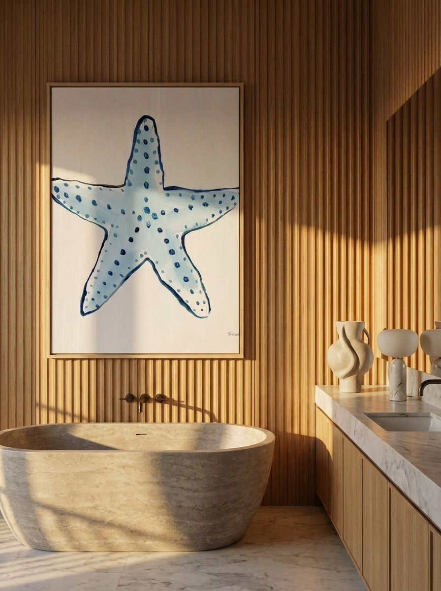 Canvas wall art with a natural timber surround styled on the wall in a luxe bathroom