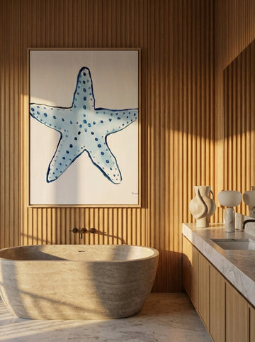Canvas wall art with a natural timber surround styled on the wall in a luxe bathroom