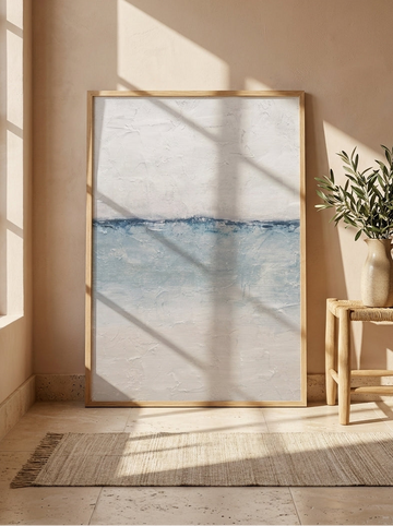 Modern wall art print leaning against the wall in a Mediterranean bathroom