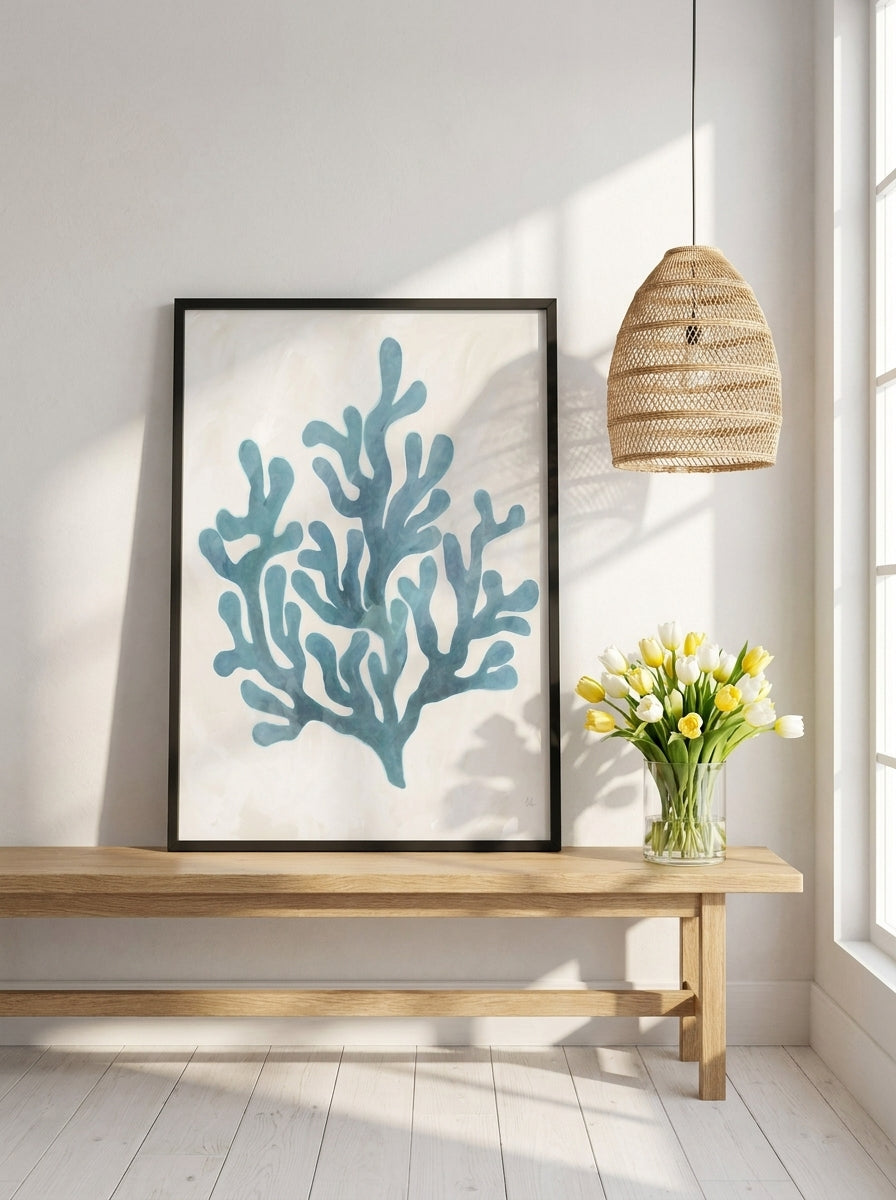 Modern wall art print standing on a bench in a bright Scandinavian bathroom