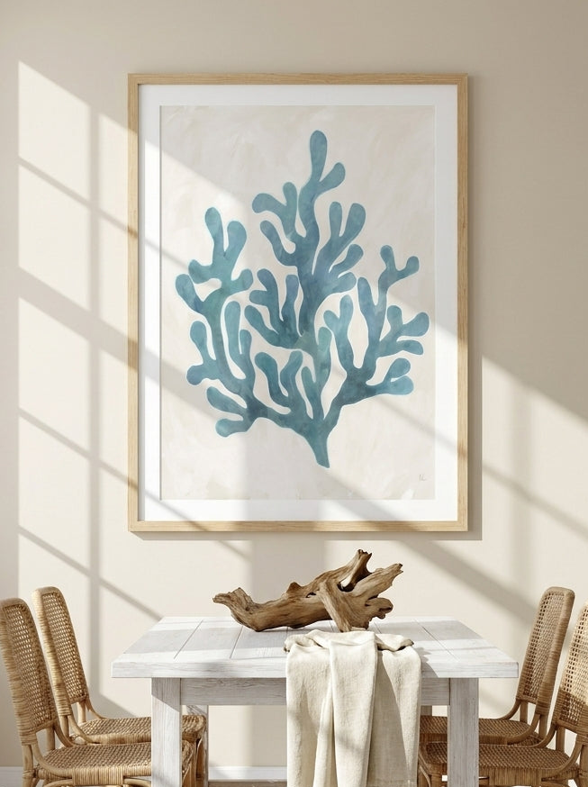 Modern wall art print styled on the wall in a coastal dining room