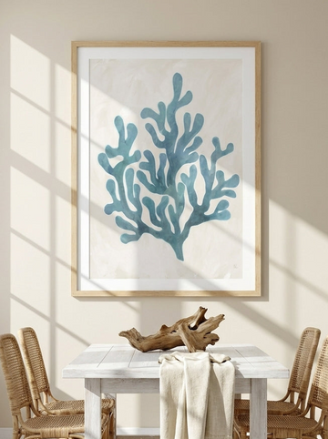 Modern wall art print styled on the wall in a coastal dining room