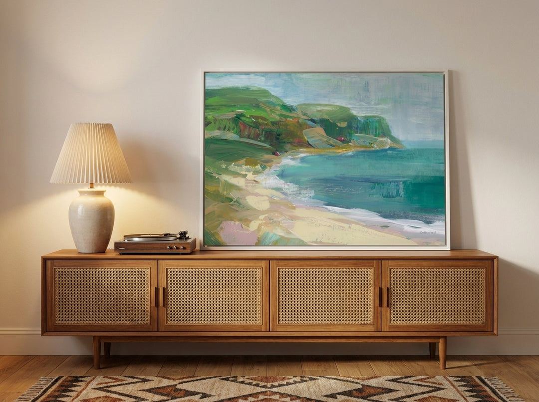 Canvas wall art with a white surround standing on a sideboard in a mid-century home office