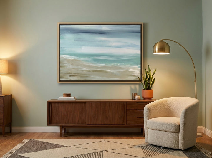 Oversized statement canvas wall art with a natural timber surround styled on the wall in a mid-century living room
