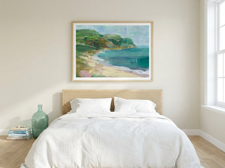 Modern wall art print styled on the wall in a coastal bedroom